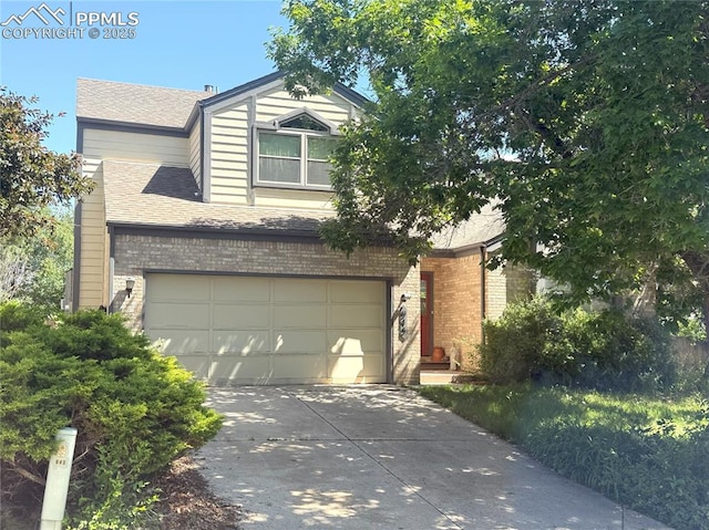 945 Marlstone Pl, Colorado Springs, CO 80904 - view of front of house featuring brick siding, concrete driveway, a shingled roof, and a garage