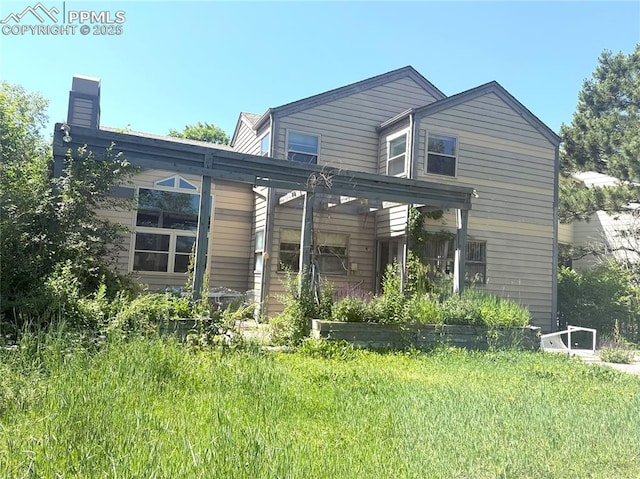 945 Marlstone Pl, Colorado Springs, CO 80904 - back of property featuring a chimney