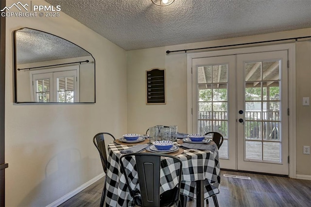 4110 Undimmed Cir, Colorado Springs, CO 80917 - dining area with french doors, a textured ceiling, dark wood-style floors, and plenty of natural light