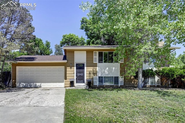 4110 Undimmed Cir, Colorado Springs, CO 80917 - split level home featuring a garage, a front yard, and driveway