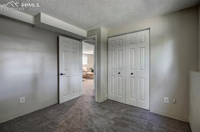 4110 Undimmed Cir, Colorado Springs, CO 80917 - unfurnished bedroom featuring carpet floors, a textured ceiling, and a closet