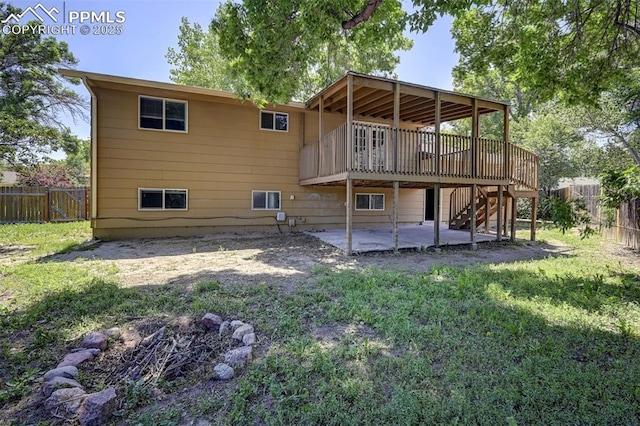 4110 Undimmed Cir, Colorado Springs, CO 80917 - back of house with a patio area, a fenced backyard, a deck, and stairway