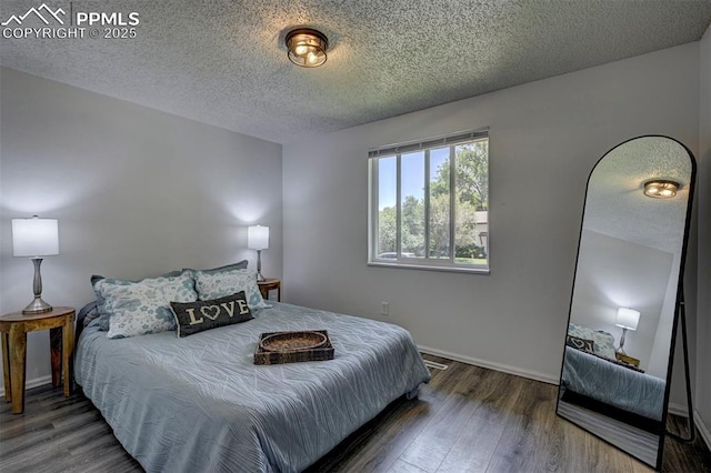 4110 Undimmed Cir, Colorado Springs, CO 80917 - bedroom with a textured ceiling and wood finished floors