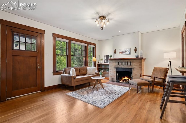 1401 N Tejon St, Colorado Springs, CO 80907 - living area featuring light wood-style floors and a fireplace