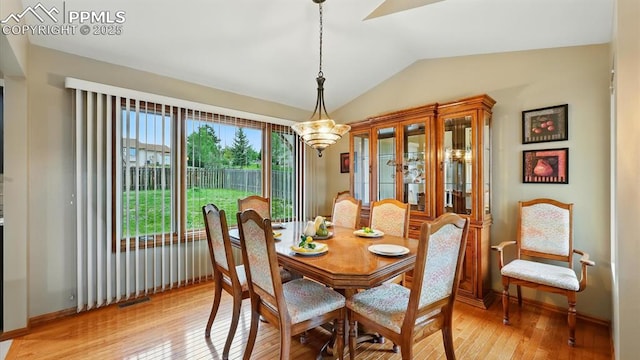 440 Torrey Pines Way, Colorado Springs, CO 80921 - dining area featuring vaulted ceiling, light wood-style floors, and a chandelier