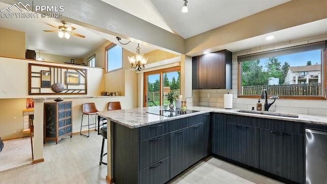 440 Torrey Pines Way, Colorado Springs, CO 80921 - kitchen with vaulted ceiling, dishwasher, a peninsula, black electric cooktop, and light stone countertops