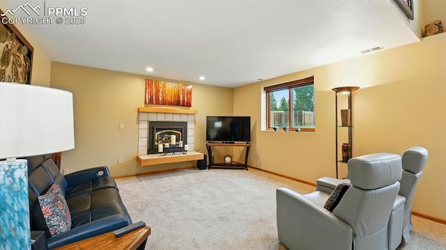 440 Torrey Pines Way, Colorado Springs, CO 80921 - living room featuring carpet floors, a tiled fireplace, and recessed lighting