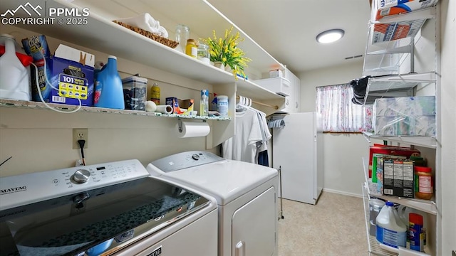 440 Torrey Pines Way, Colorado Springs, CO 80921 - laundry area with separate washer and dryer and light carpet