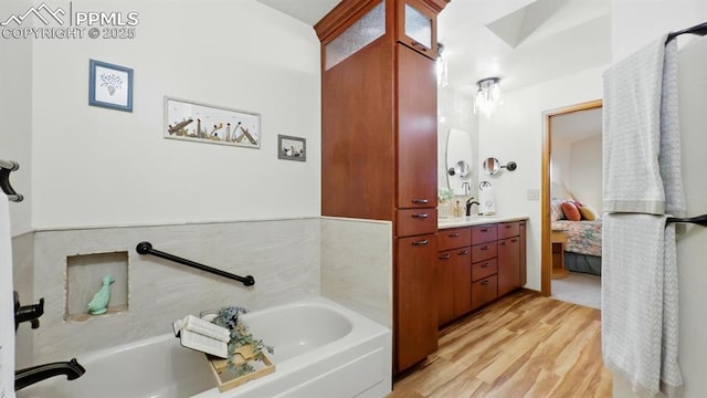 440 Torrey Pines Way, Colorado Springs, CO 80921 - full bath with vanity, wood finished floors, a garden tub, and ensuite bathroom