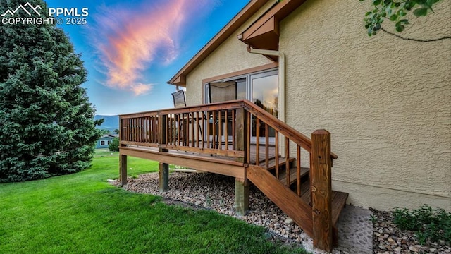 440 Torrey Pines Way, Colorado Springs, CO 80921 - deck at dusk with a yard