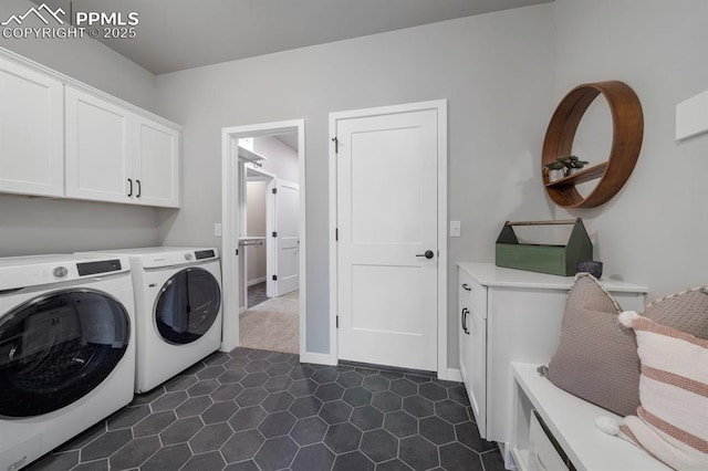 9996 Antelope Ravine Dr, Colorado Springs, CO 80908 - laundry room featuring cabinet space, separate washer and dryer, and dark tile patterned flooring