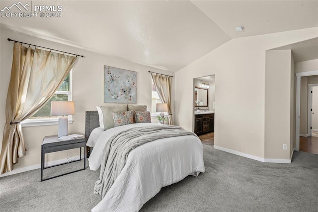 5060 Galloping Goose Way, Colorado Springs, CO 80924 - carpeted bedroom with multiple windows, lofted ceiling, and ensuite bathroom