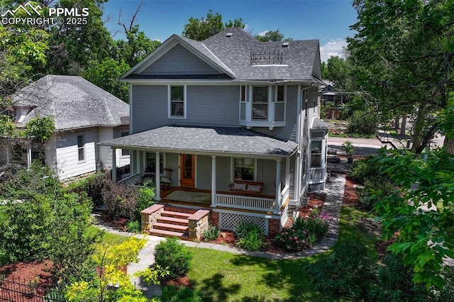 2302 W Kiowa St, Colorado Springs, CO 80904 - victorian house featuring roof with shingles and a porch
