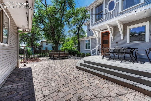 2302 W Kiowa St, Colorado Springs, CO 80904 - view of patio / terrace featuring outdoor dining area and a wooden deck