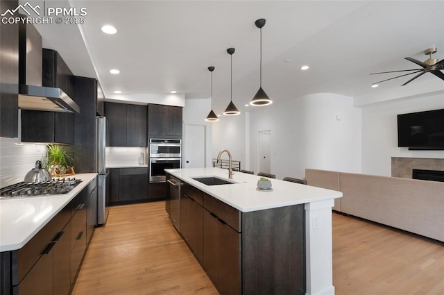 4841 Hanging Lake Cir, Colorado Springs, CO 80924 - kitchen featuring stainless steel appliances, light countertops, modern cabinets, wall chimney exhaust hood, and recessed lighting