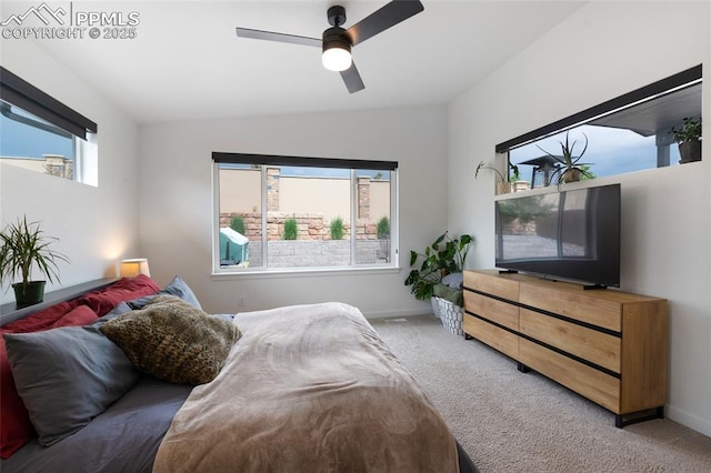 4841 Hanging Lake Cir, Colorado Springs, CO 80924 - carpeted bedroom with multiple windows, vaulted ceiling, and a ceiling fan