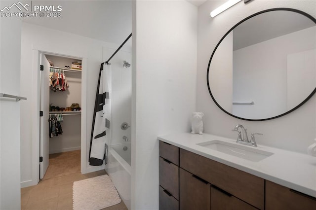 4841 Hanging Lake Cir, Colorado Springs, CO 80924 - bathroom with vanity, shower / tub combo with curtain, a spacious closet, and tile patterned flooring