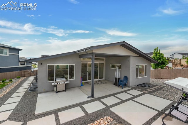 4841 Hanging Lake Cir, Colorado Springs, CO 80924 - back of house featuring a fenced backyard, stucco siding, and a patio
