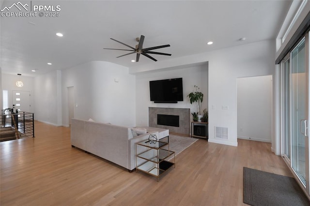 4841 Hanging Lake Cir, Colorado Springs, CO 80924 - living area featuring light wood-type flooring, a fireplace, ceiling fan, and recessed lighting