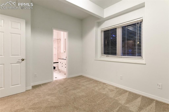 6972 Granite Peak Dr, Colorado Springs, CO 80923 - unfurnished bedroom featuring carpet floors and ensuite bathroom