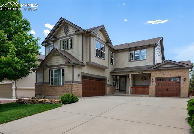 7665 Manston Dr, Colorado Springs, CO 80920 - craftsman-style home with covered porch, concrete driveway, brick siding, and a garage