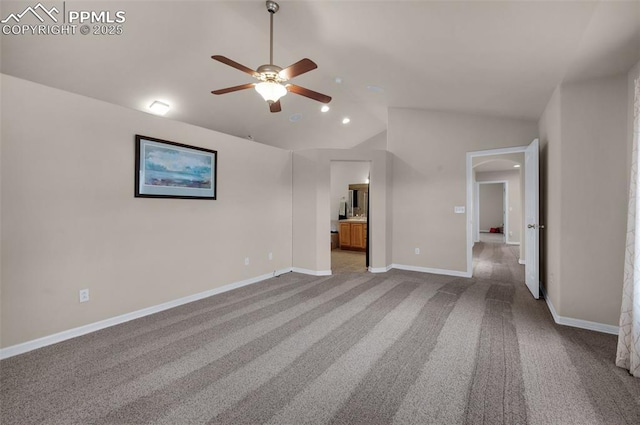 7665 Manston Dr, Colorado Springs, CO 80920 - unfurnished bedroom with lofted ceiling, carpet floors, arched walkways, ensuite bath, and ceiling fan