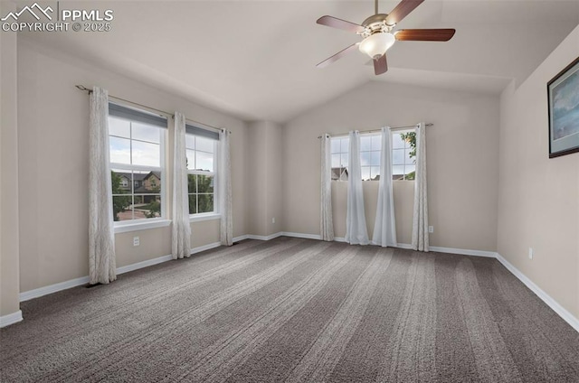 7665 Manston Dr, Colorado Springs, CO 80920 - spare room featuring plenty of natural light, lofted ceiling, a ceiling fan, and carpet flooring
