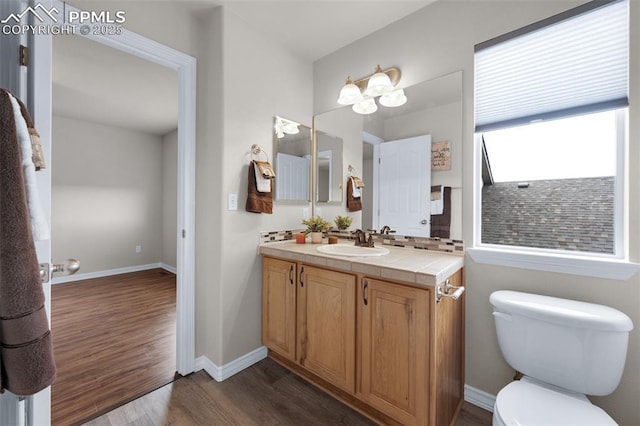 7665 Manston Dr, Colorado Springs, CO 80920 - bathroom featuring wood finished floors and vanity