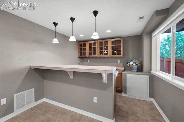 7665 Manston Dr, Colorado Springs, CO 80920 - bar area with decorative light fixtures and recessed lighting