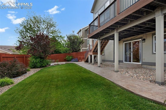 7665 Manston Dr, Colorado Springs, CO 80920 - view of yard with stairs and a deck