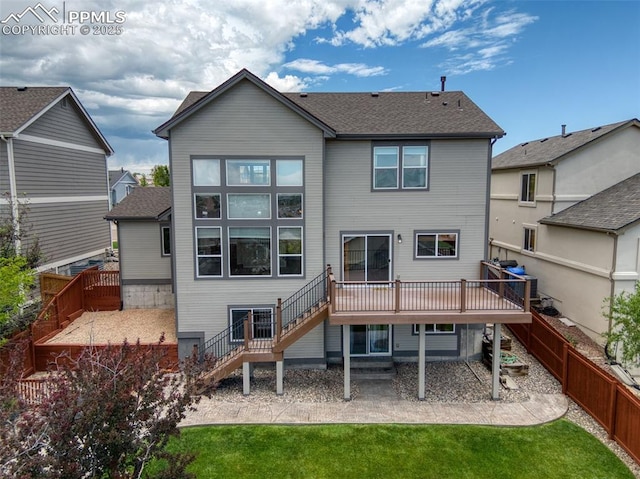 7665 Manston Dr, Colorado Springs, CO 80920 - rear view of house with stairway, a fenced backyard, a deck, and a patio area