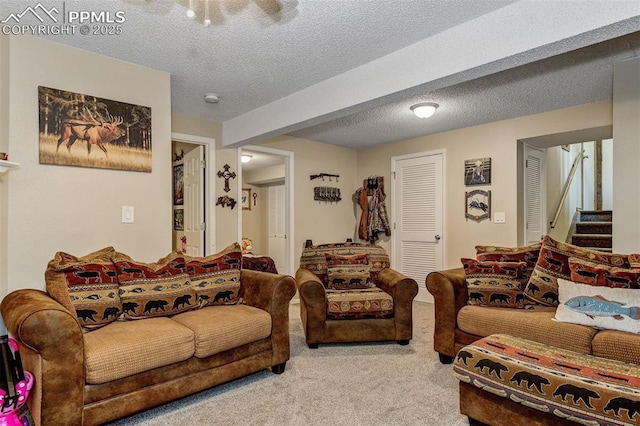 601 Harvest Field Way, Fountain, CO 80817 - living room featuring carpet flooring, a textured ceiling, and stairway