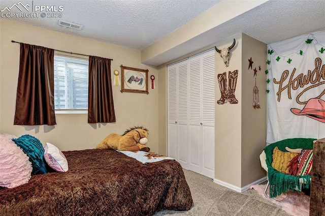 601 Harvest Field Way, Fountain, CO 80817 - carpeted bedroom featuring a textured ceiling and a closet