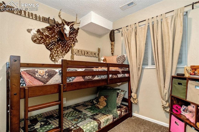 601 Harvest Field Way, Fountain, CO 80817 - bedroom with carpet floors and a textured ceiling