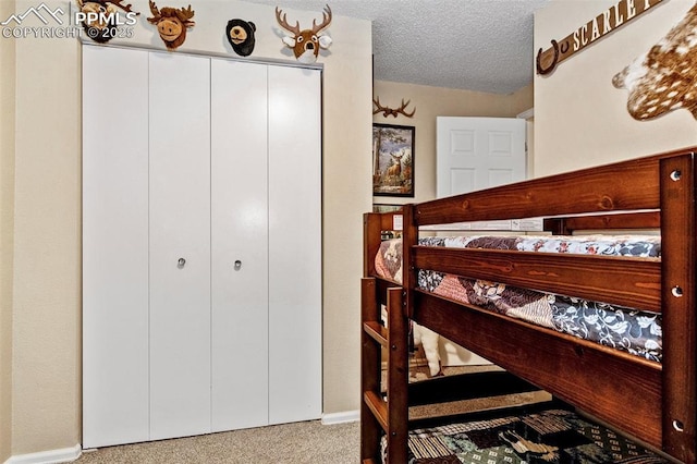 601 Harvest Field Way, Fountain, CO 80817 - carpeted bedroom with baseboards and a textured ceiling