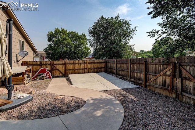 601 Harvest Field Way, Fountain, CO 80817 - fenced backyard with a patio