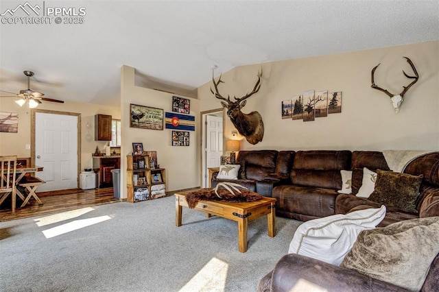 601 Harvest Field Way, Fountain, CO 80817 - carpeted living room featuring vaulted ceiling and a ceiling fan