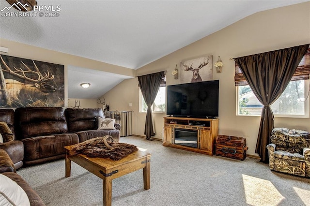601 Harvest Field Way, Fountain, CO 80817 - living area featuring lofted ceiling, light colored carpet, and radiator