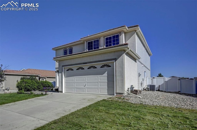 9444 Castle Oaks Dr, Fountain, CO 80817 - traditional home featuring concrete driveway, a garage, and stucco siding