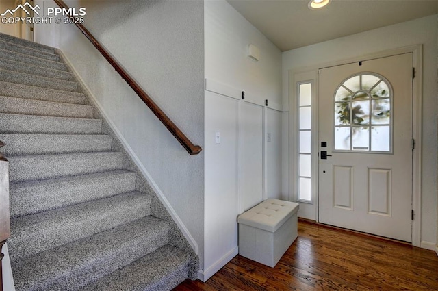 9444 Castle Oaks Dr, Fountain, CO 80817 - foyer entrance featuring stairs, wood finished floors, and recessed lighting