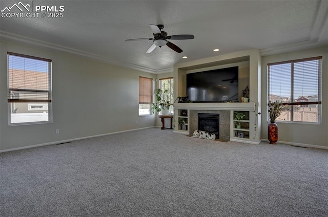 9444 Castle Oaks Dr, Fountain, CO 80817 - unfurnished living room with ceiling fan, plenty of natural light, carpet flooring, crown molding, and recessed lighting