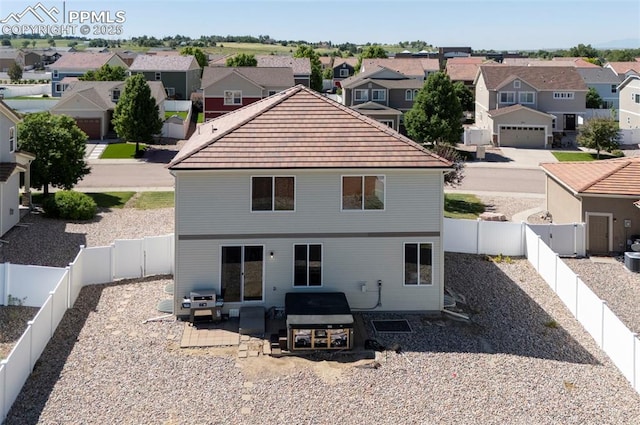 9444 Castle Oaks Dr, Fountain, CO 80817 - back of house featuring a residential view, a tiled roof, a patio, and a fenced backyard
