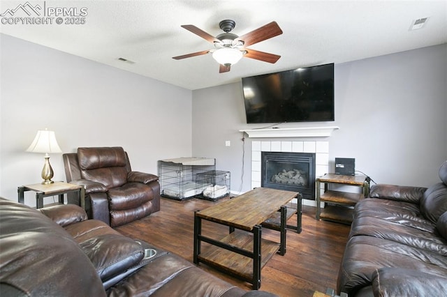 1360 Piros Dr, Colorado Springs, CO 80922 - living room featuring wood finished floors, ceiling fan, and a fireplace