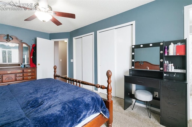 1360 Piros Dr, Colorado Springs, CO 80922 - bedroom with multiple closets, carpet flooring, and a ceiling fan