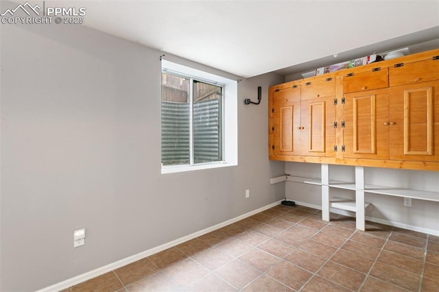 1360 Piros Dr, Colorado Springs, CO 80922 - laundry room featuring tile patterned flooring and baseboards