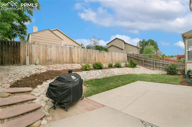 1360 Piros Dr, Colorado Springs, CO 80922 - fenced backyard with a patio area