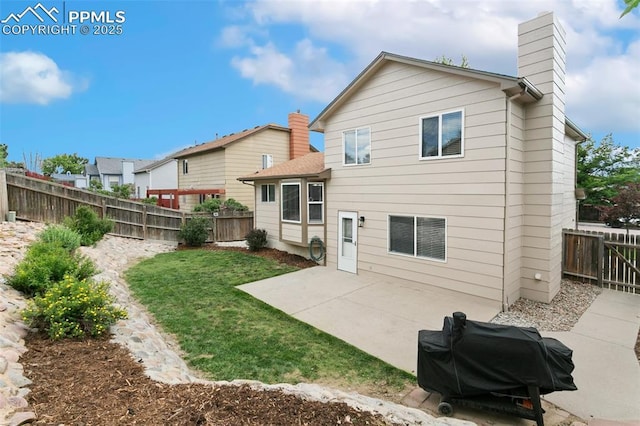 1360 Piros Dr, Colorado Springs, CO 80922 - back of house featuring a patio, a chimney, and a fenced backyard