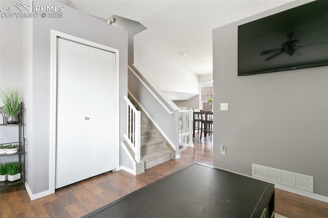 1360 Piros Dr, Colorado Springs, CO 80922 - entryway featuring stairs, wood finished floors, and ceiling fan