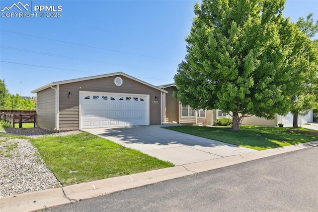 4680 Pika Pt, Colorado Springs, CO 80922 - view of front of home featuring a garage and a front lawn