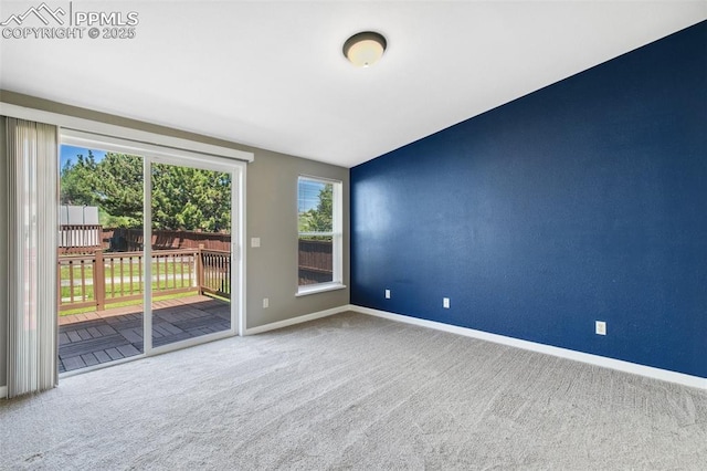 4680 Pika Pt, Colorado Springs, CO 80922 - carpeted spare room with baseboards and lofted ceiling